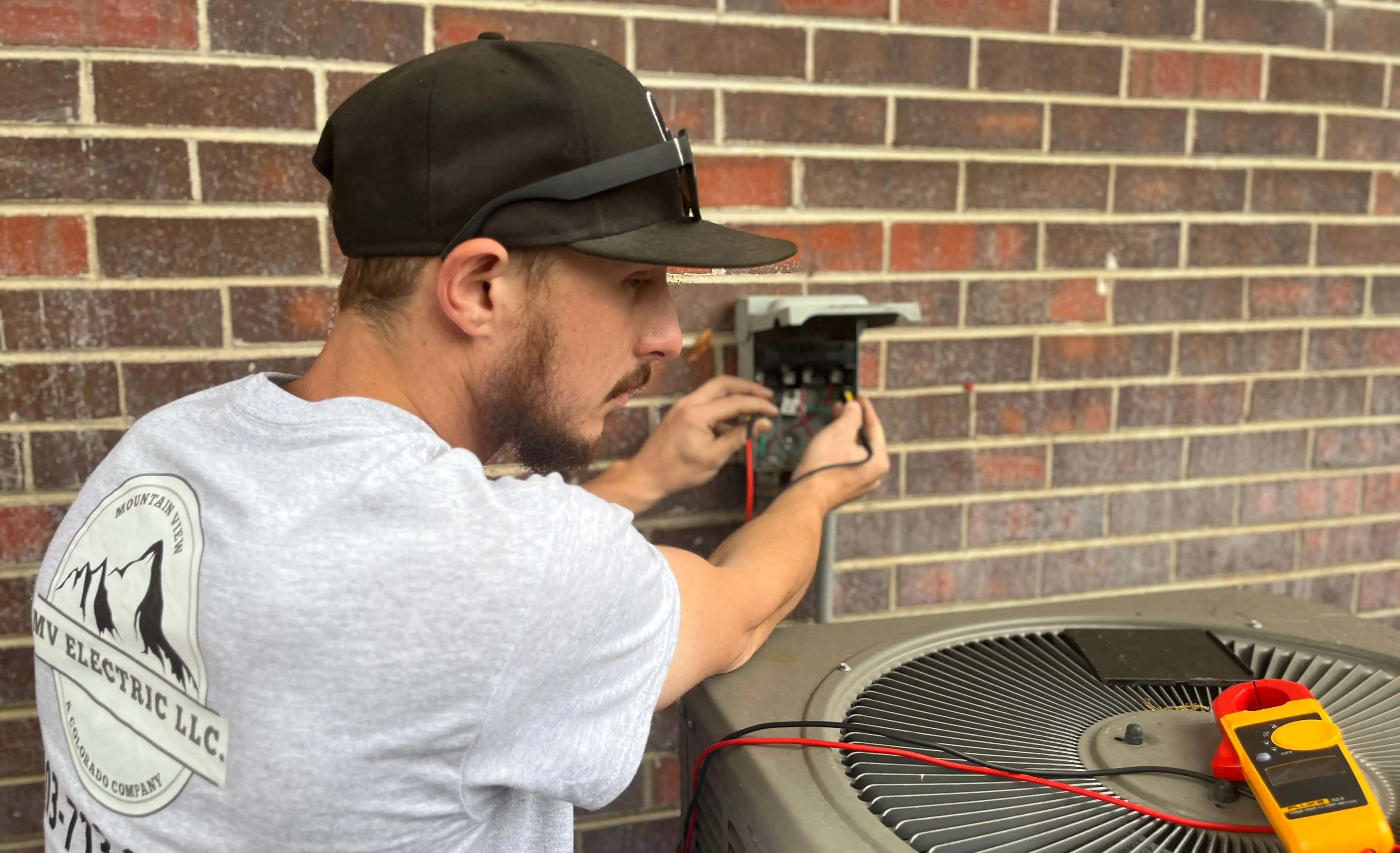 Mountain View Electric team member installing electrical equipment